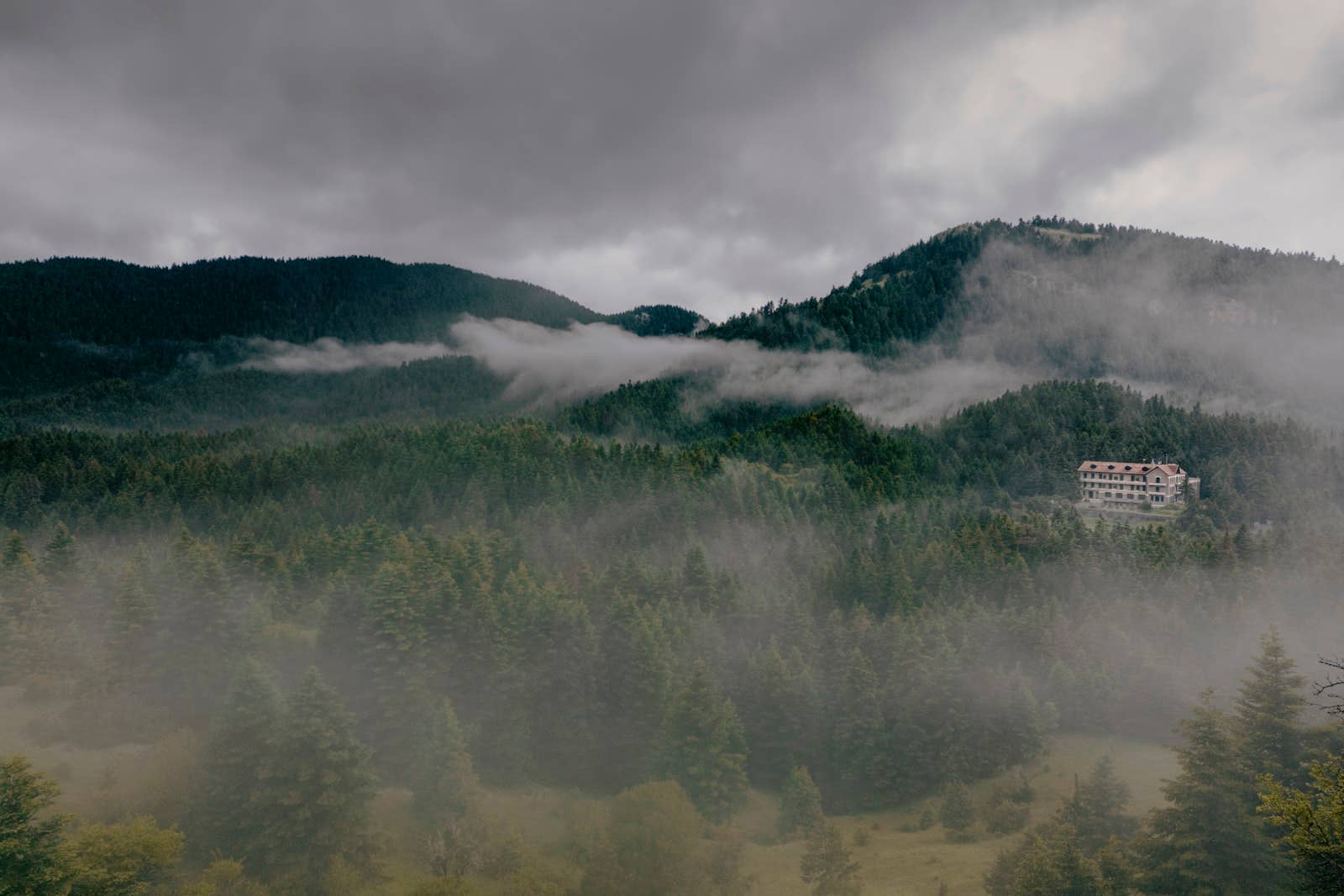 Open book titled "Remote Places to Stay Vol. 2" by gestalten & teNeues, showcasing scenic travel photography inside.