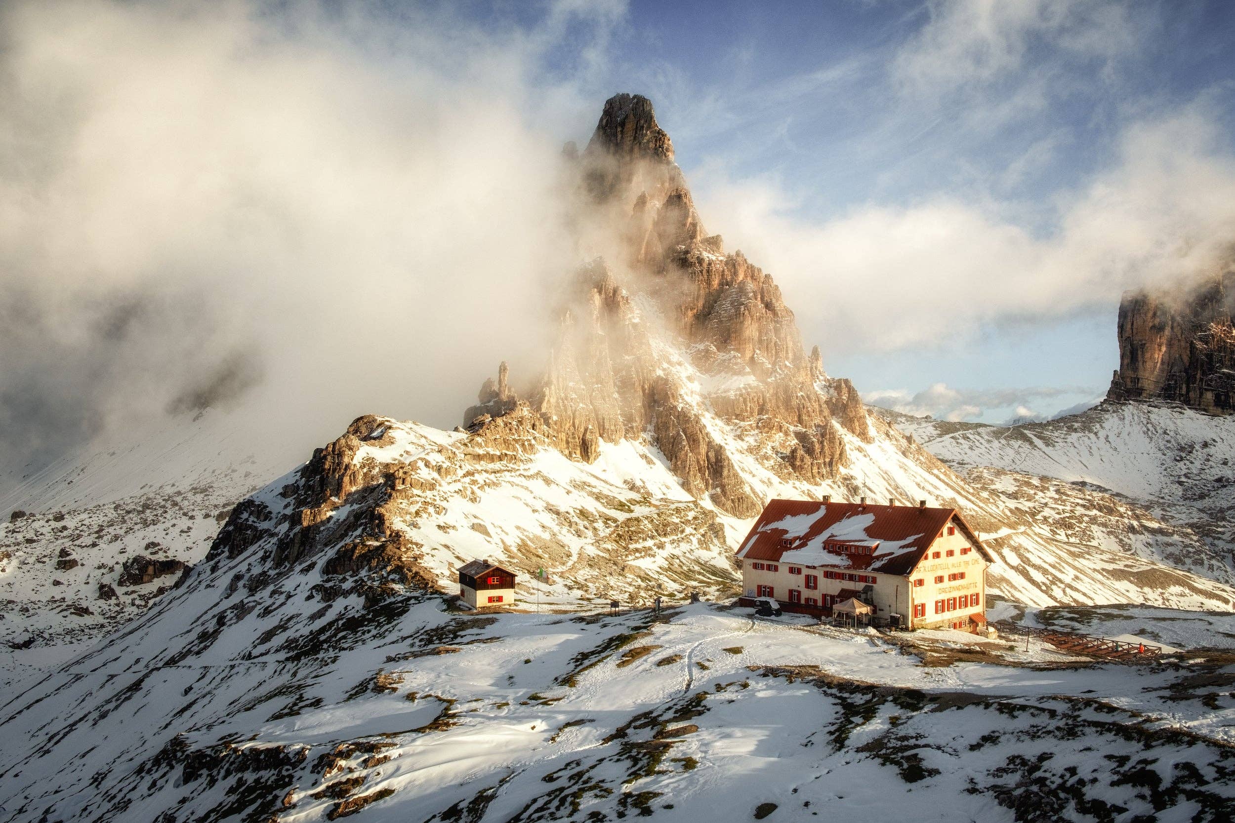 Open book titled "Wanderlust Alps" by gestalten & teNeues featuring scenic mountain photography on its pages.