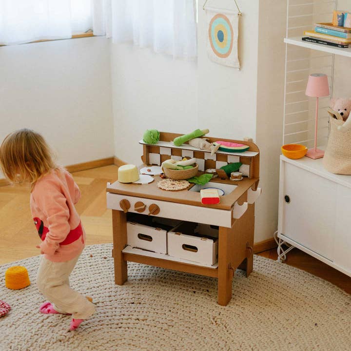 Play Kitchen Tasty by Papperlapapp featuring colorful toy kitchen appliances and utensils for imaginative play.