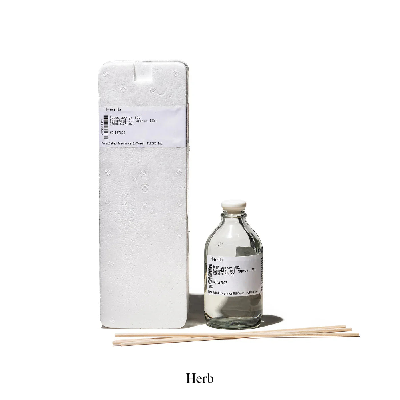Puebco formulated fragrance diffuser with elegant glass bottle and reed sticks for home scent diffusion.