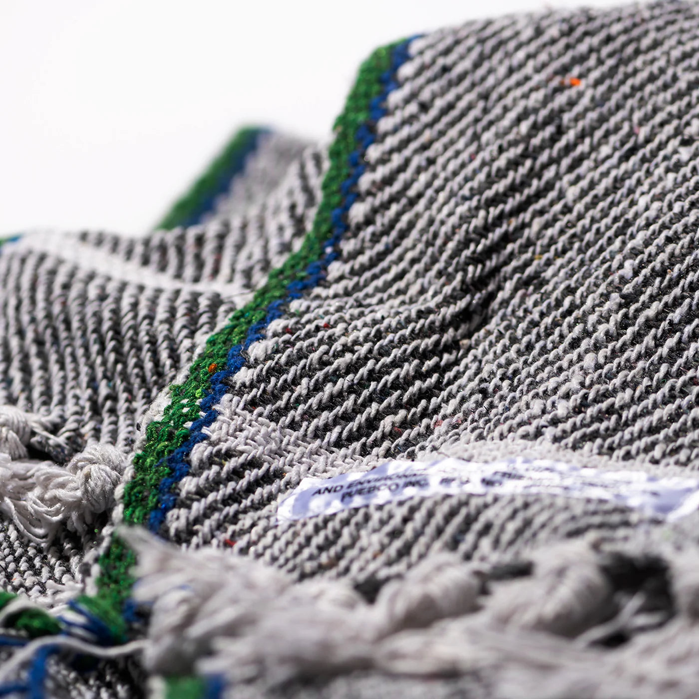 Puebco Clubhouse Blanket with cozy, textured fabric in neutral tones, perfect for lounging and staying warm.