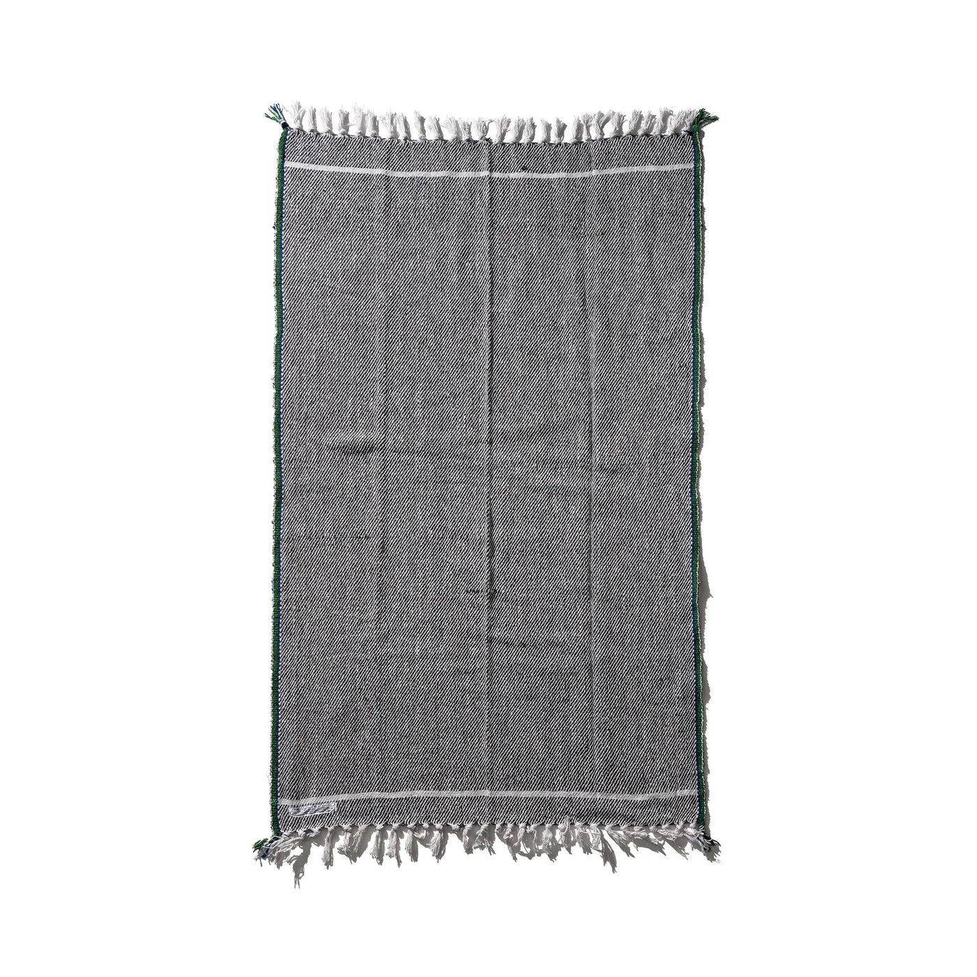 Puebco Clubhouse Blanket featuring soft, cozy fabric with a neutral color, perfect for staying warm and comfortable.