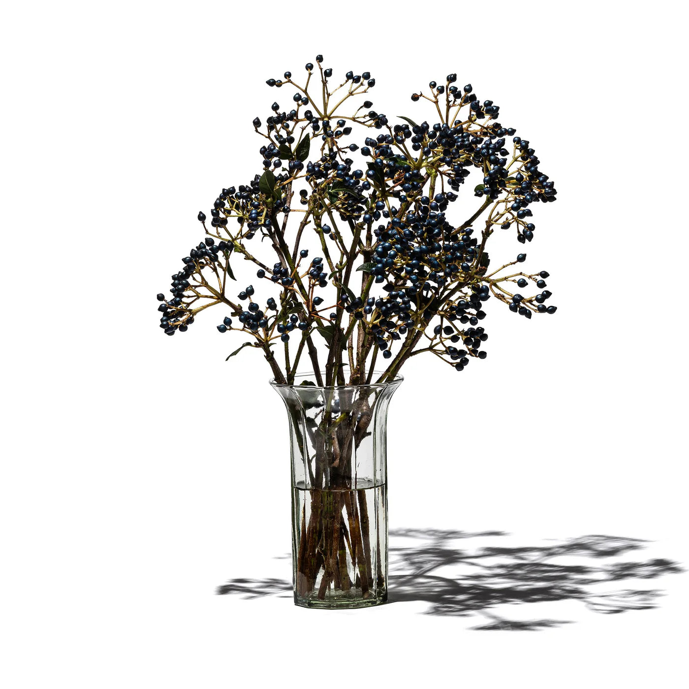 Recycled glass vase by Puebco, showcasing a transparent, eco-friendly decorative vessel with a smooth, rounded shape.