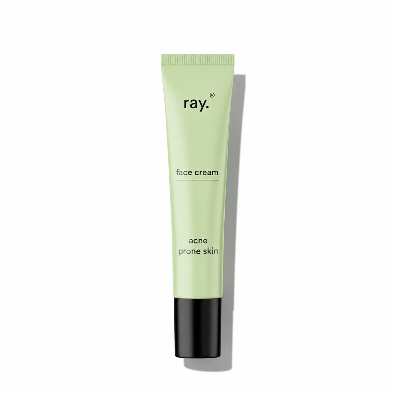 Ray face cream for acne-prone skin in a white jar with a silver lid, designed to soothe and clear blemished skin.