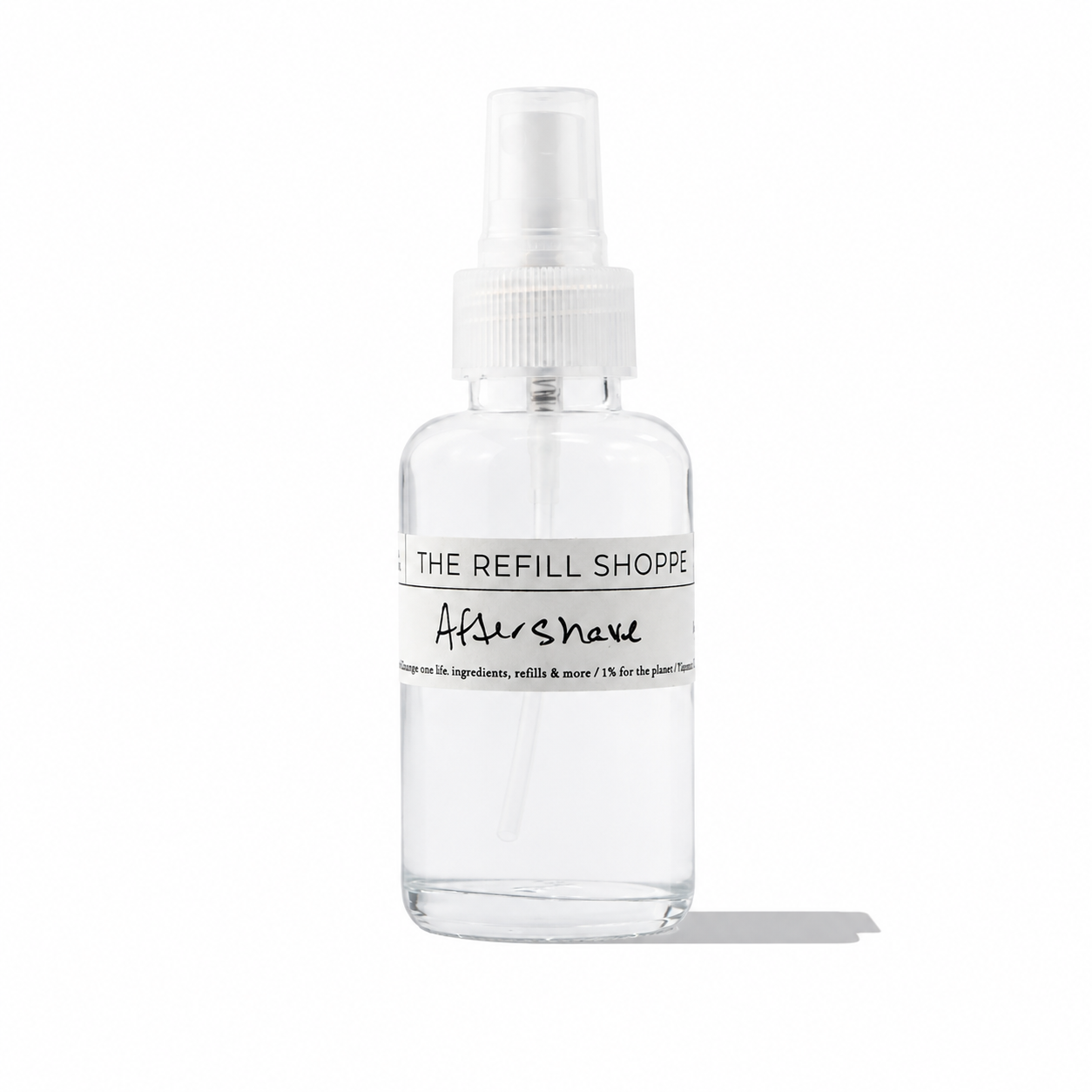 The Refill Shoppe aftershave bottle with a minimalist label, showcasing a clear glass container and silver cap.