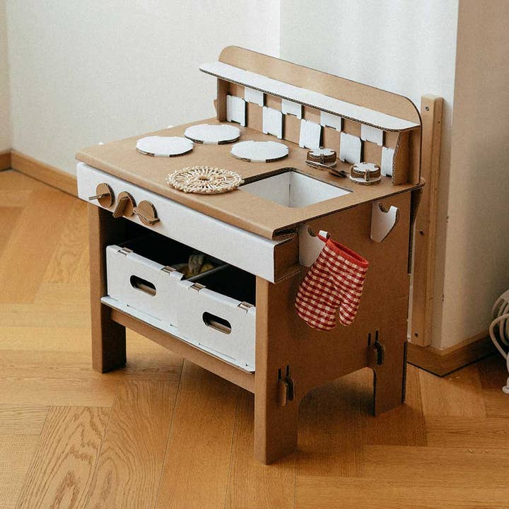 Papperlapapp Play Kitchen Tasty toy kitchen with colorful stove, oven, and utensils for imaginative play.