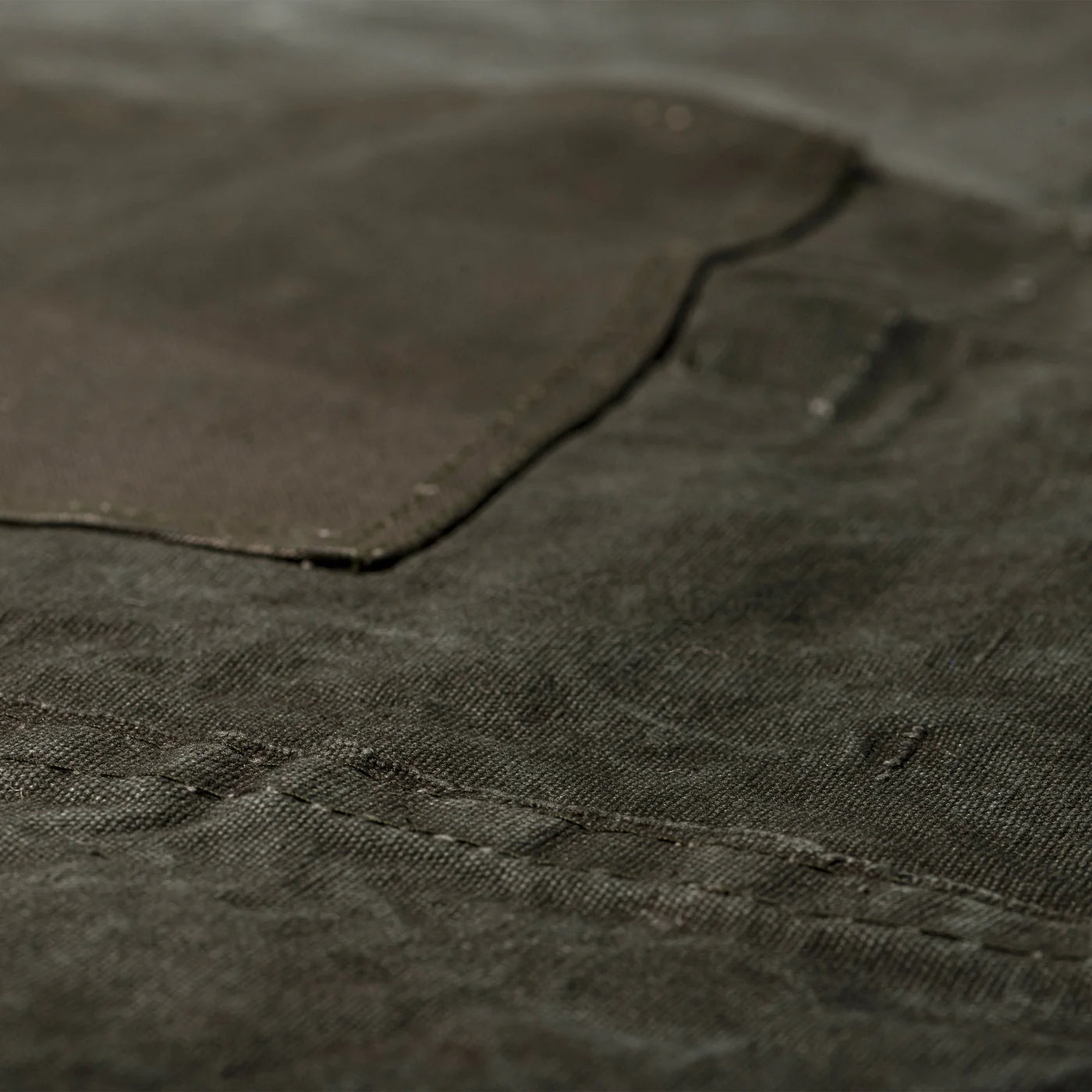 Vintage tent fabric apron by Puebco, showcasing a rugged, durable apron with rustic tent fabric and adjustable straps.