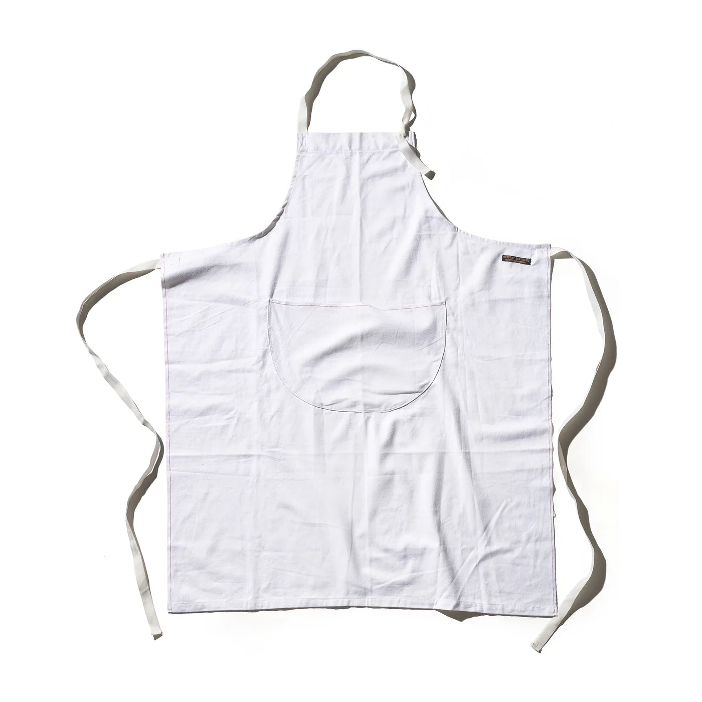 Puebco utility apron with multiple pockets, made of durable fabric, designed for practical work and everyday use.