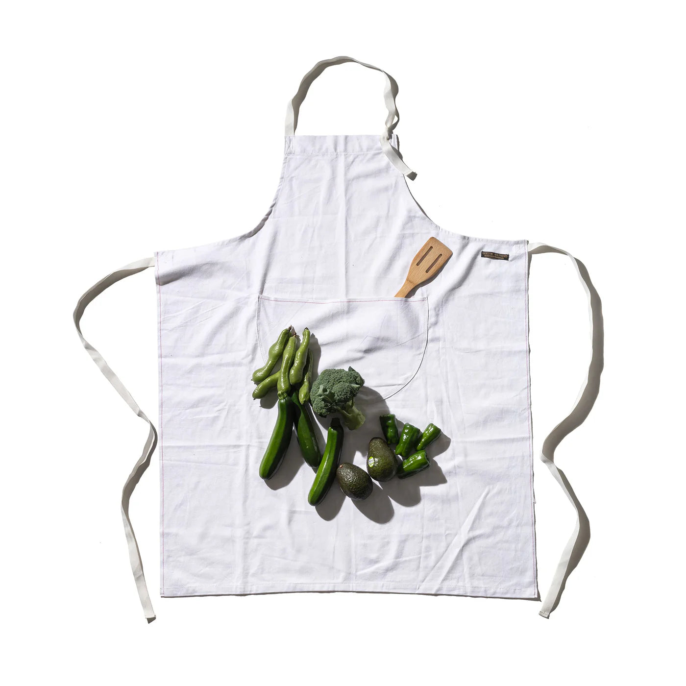 Puebco utility apron in durable fabric with multiple pockets, ideal for work or gardening tasks.