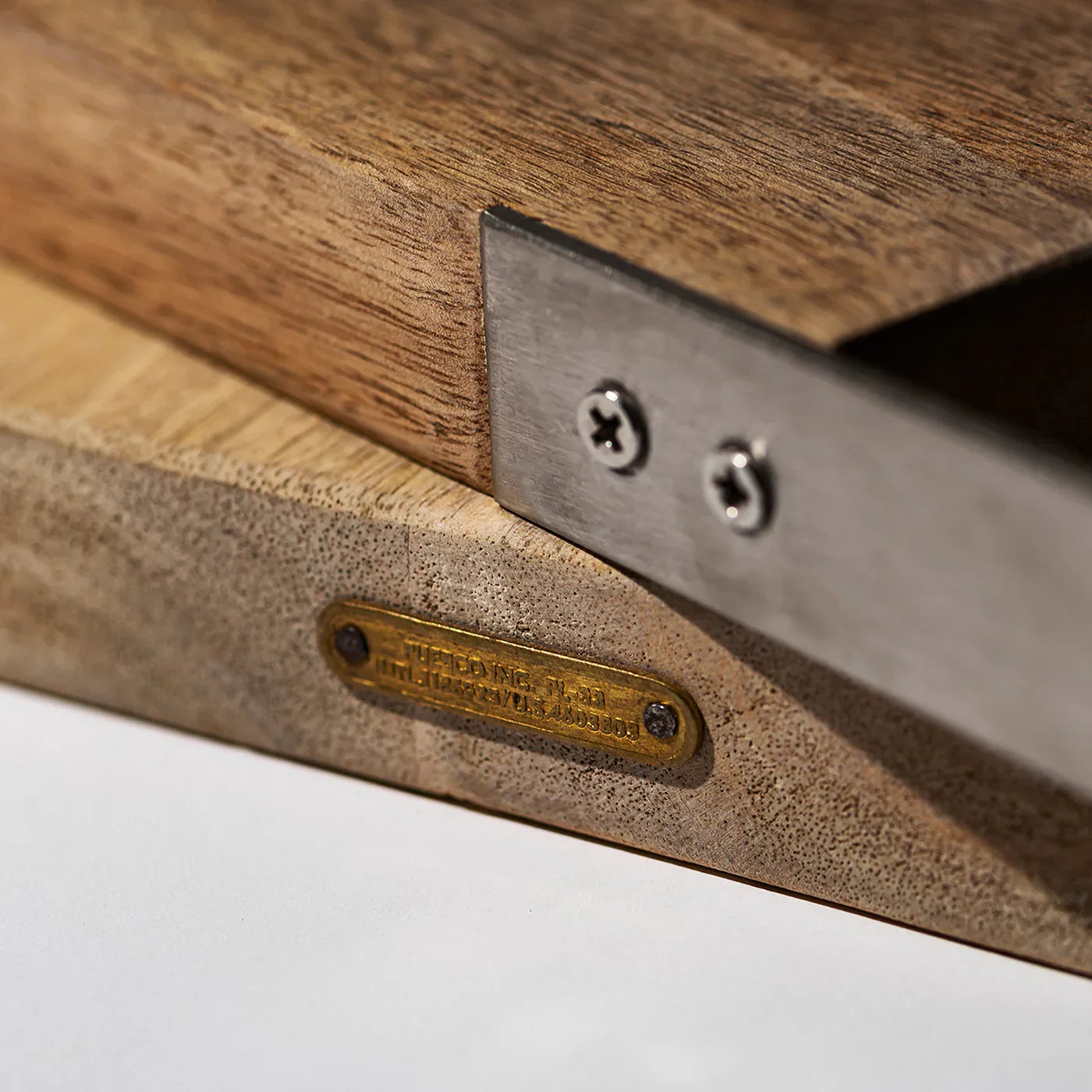 Puebco wooden cutting board with smooth surface and rounded edges, ideal for food preparation in a modern kitchen.