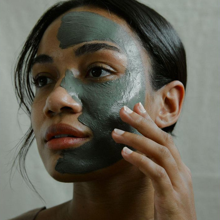 Charcoal cream mask from The Refill Shoppe, skincare product in a jar with a dark gray charcoal-colored cream inside.