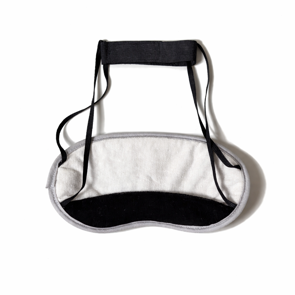 Charcoal eye mask by Morihata International Ltd. Co., soft fabric covering the eyes with charcoal-infused material for soothing relief.