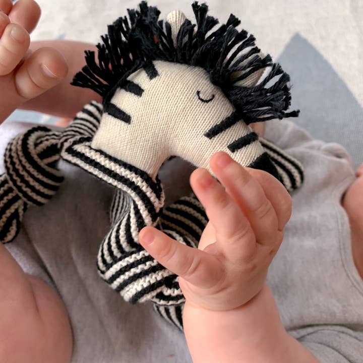 Soft baby cuddle cloth featuring a zebra design by Sophie Home Ltd, perfect for newborns and infant comfort.
