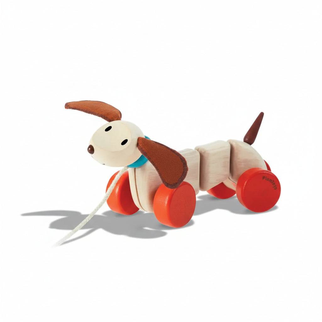 Cute wooden Happy Puppy toy by PlanToys, featuring a cheerful puppy with painted details and a playful expression.