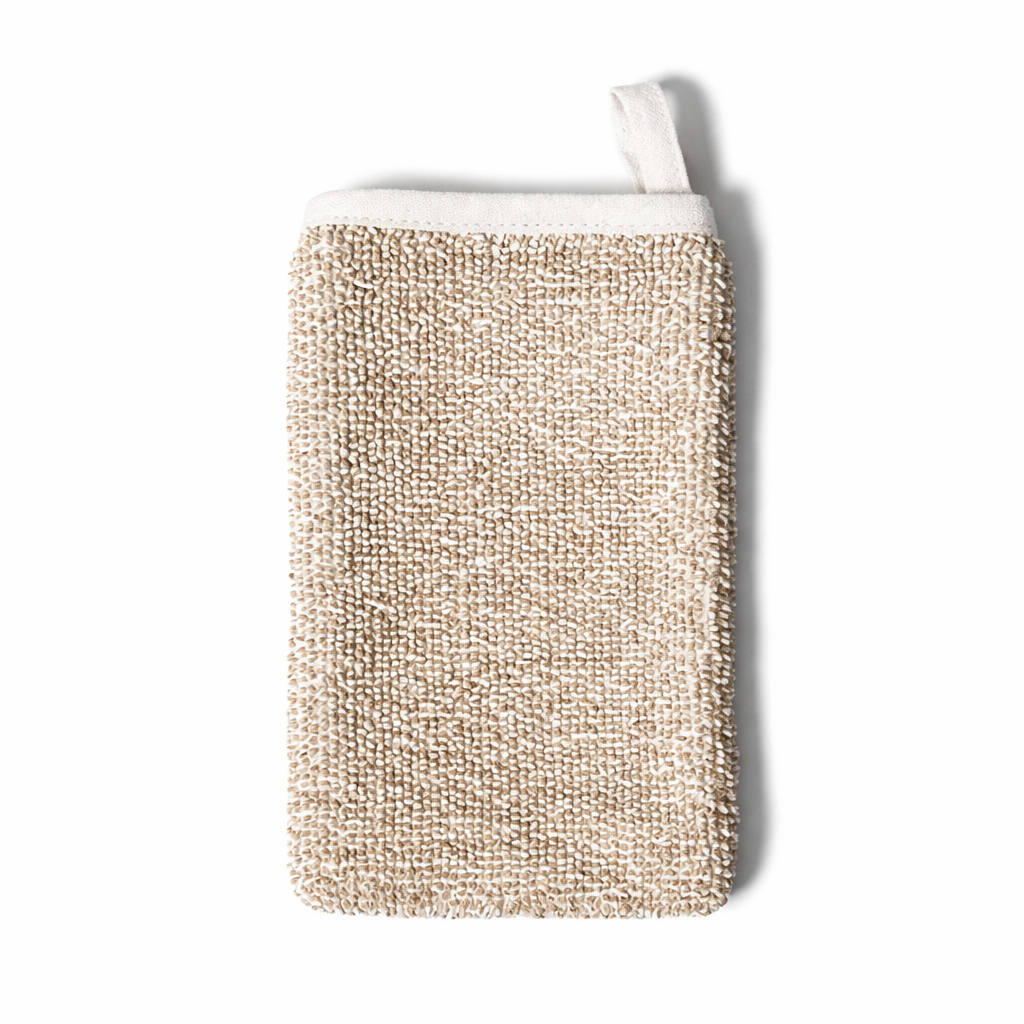 Morihata International Ltd. Co. deep exfoliating body scrub mitt with textured surface for gentle skin exfoliation.