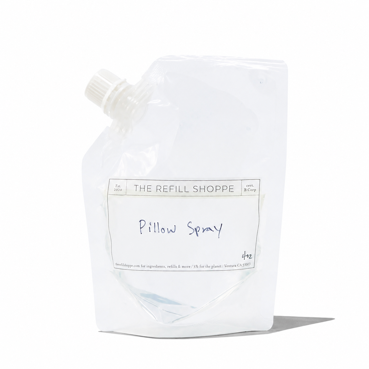 The Refill Shoppe pillow spray bottle with a floral label, designed to freshen and scent pillows and bedding naturally.
