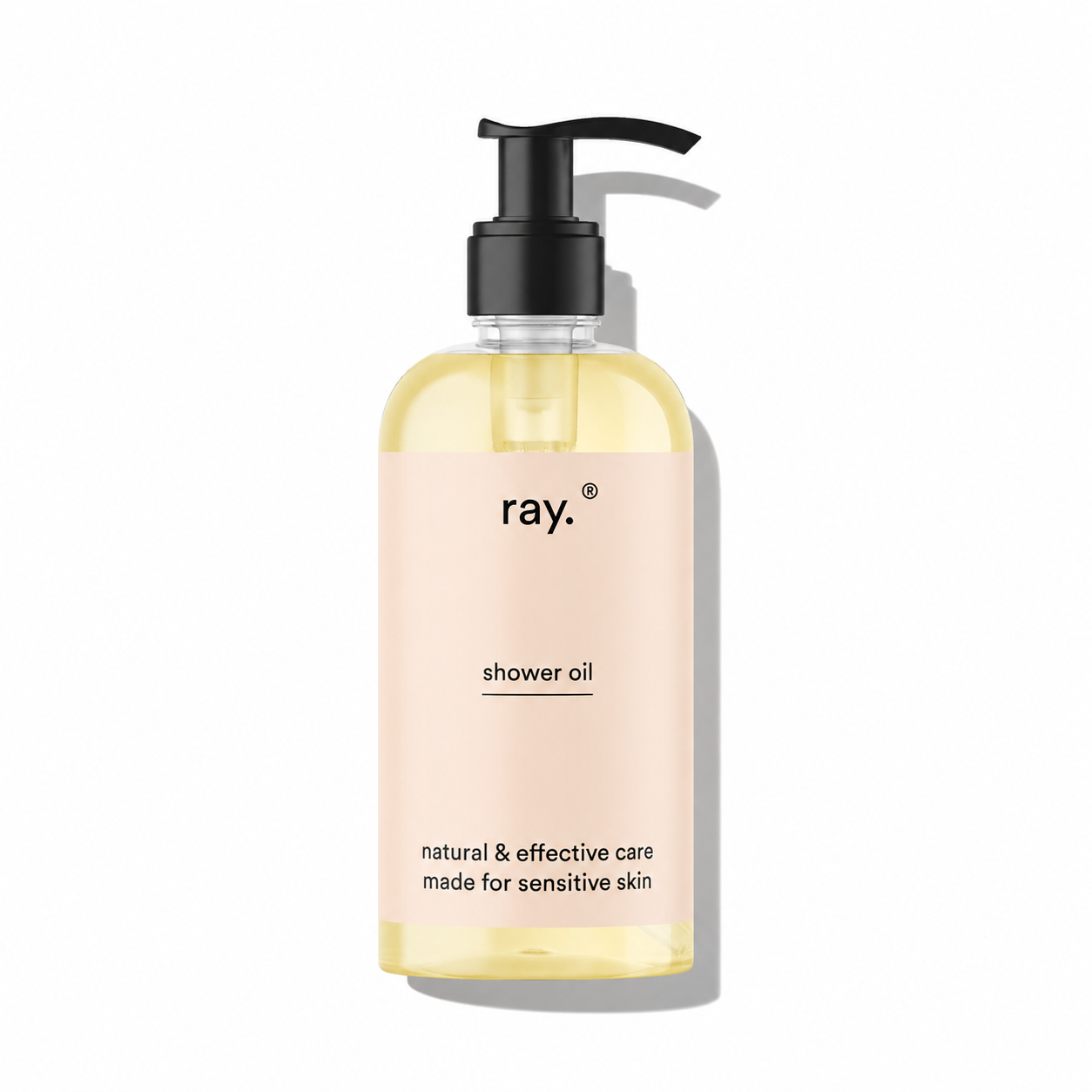 Ray cleansing shower oil bottle with pump dispenser, showing the product label and clear liquid inside.