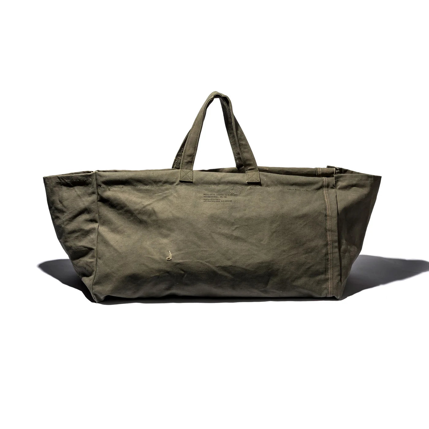 Large vintage tent fabric bag by Puebco, showing rugged canvas material and spacious interior for storage or carrying items.