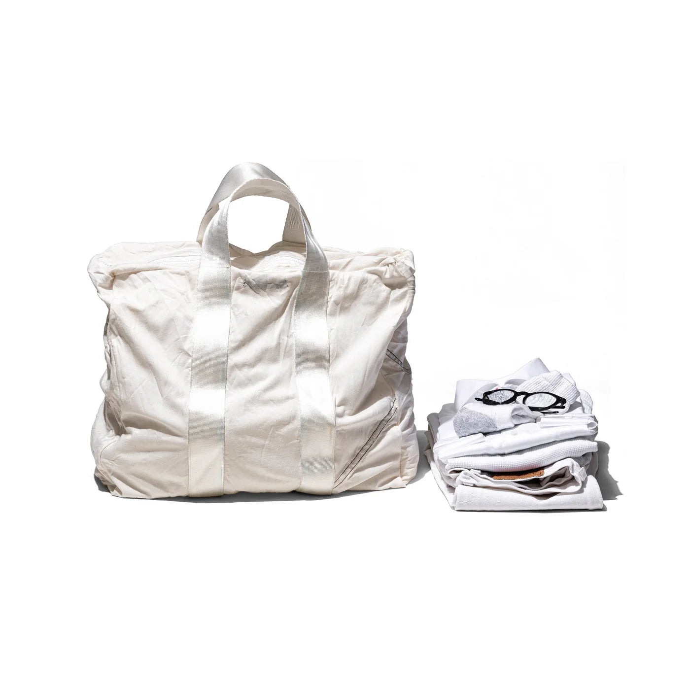 Vintage Puebco parachute tote bag with durable fabric and spacious interior, featuring sturdy handles and a classic parachute design.