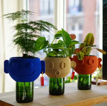 Ceramic flower pot by Stuart Studio with a modern, textured design, ideal for indoor plants and home decor.