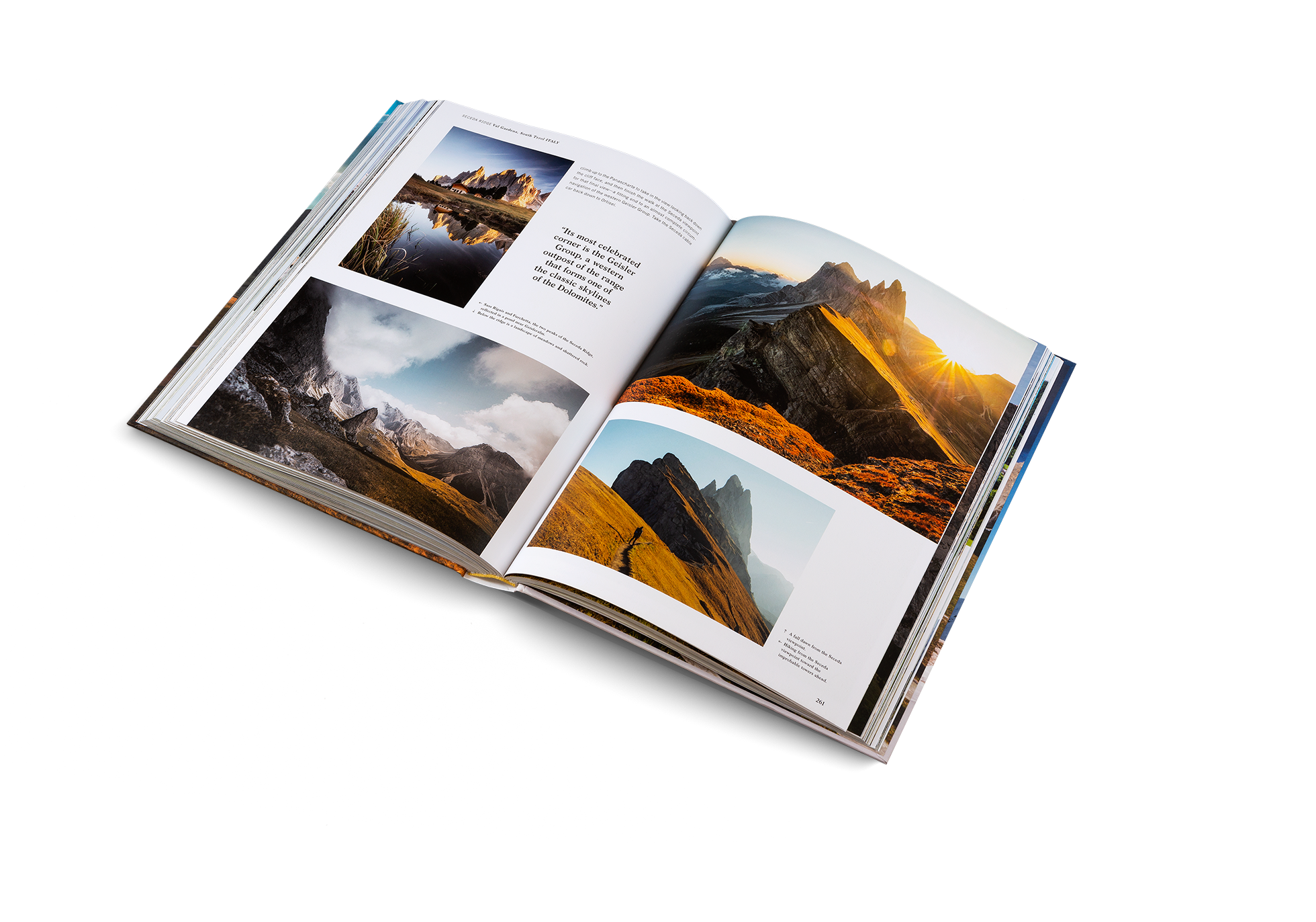 Open book titled Wanderlust Alps featuring scenic mountain photography in a Gestaltung & teNeues publication.