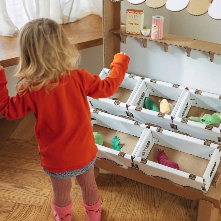 Colorful Hoot 'n Toot Market playset by Papperlapapp featuring wooden food items and market accessories for imaginative play.