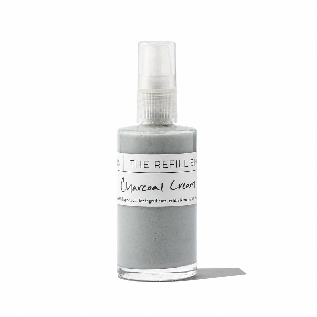 The Refill Shoppe charcoal cream mask in a jar for skincare, showing the black cream inside.