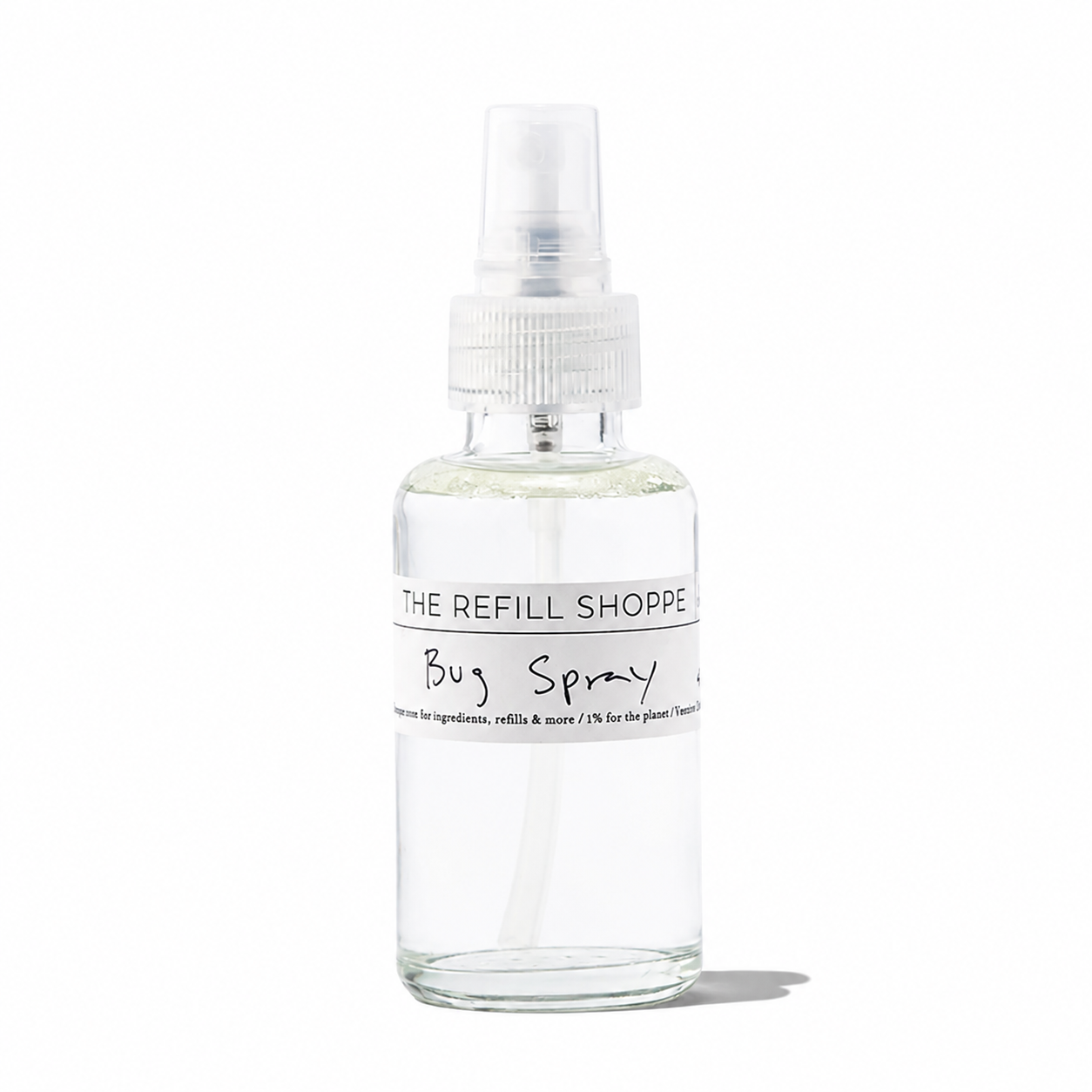 The Refill Shoppe bug spray bottle with natural ingredients, designed to repel insects outdoors and protect skin from bites.
