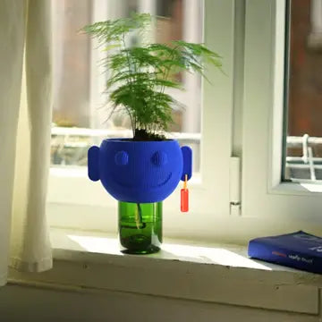 Decorative flower pot by Stuart Studio with a modern design, suitable for indoor or outdoor plant arrangements.
