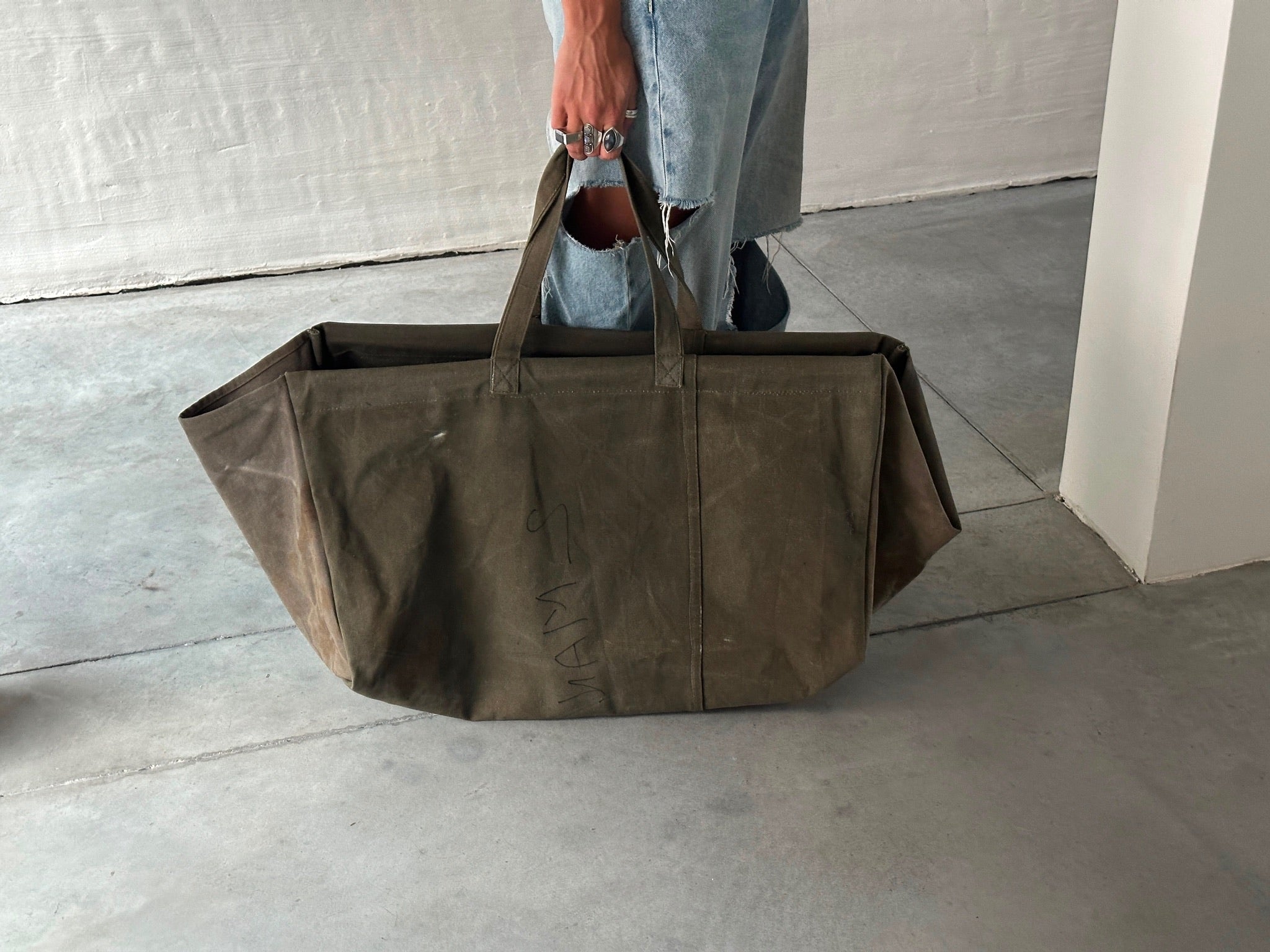 Puebco vintage tent fabric large bag with sturdy handles, showcasing a durable, rustic design perfect for carrying essentials.