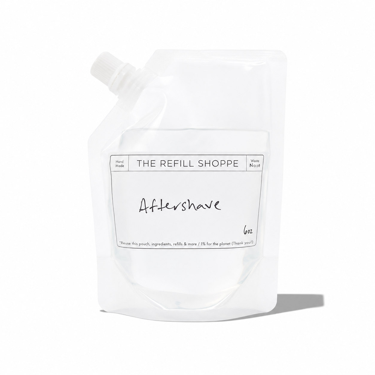 The Refill Shoppe aftershave bottle with a minimalist label, showcasing a clear liquid inside, for refreshed skin after shaving.