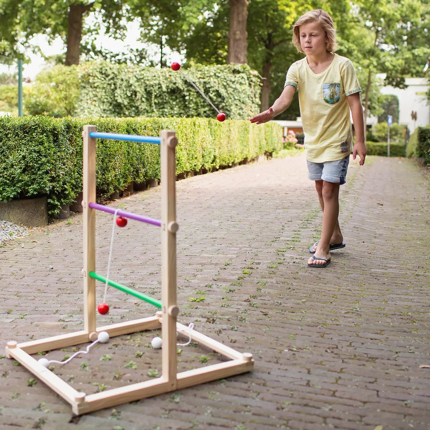Colorful BS Toys Ring Toss Game with wooden pegs and rings for outdoor or indoor play, perfect for family fun and coordination skills.