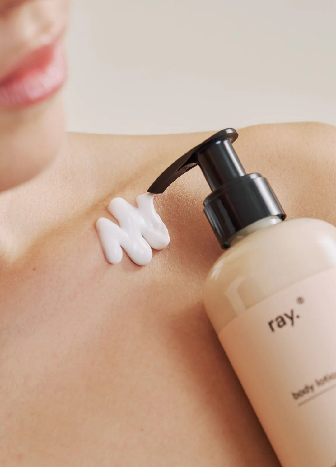 Ray body lotion bottle with a sleek design, showcasing the moisturizing product in a clean, minimalist setting.
