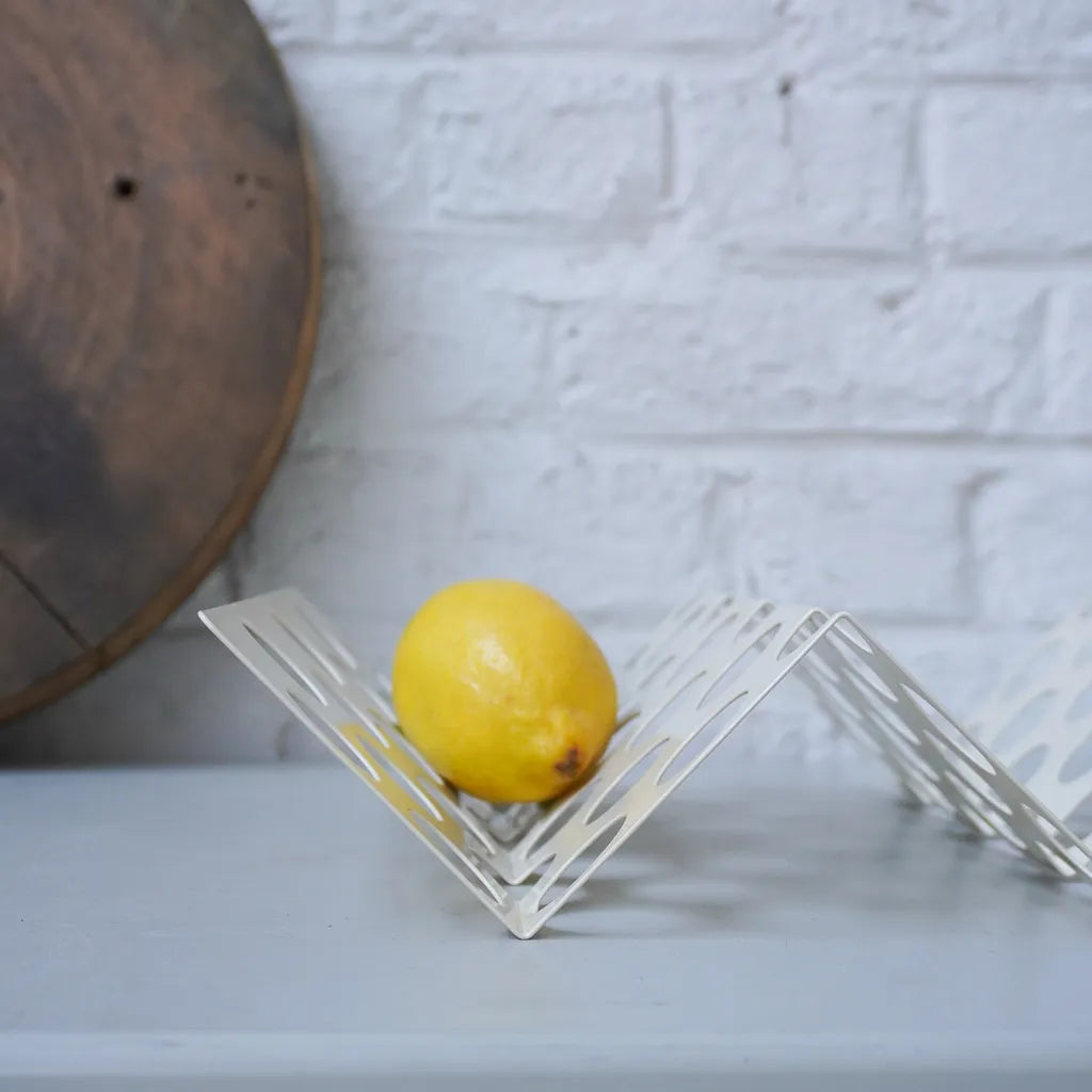 Colorful fruit platter 'Zig Zag' by Halfwerk featuring an assortment of fresh, sliced fruits arranged in a zigzag pattern.