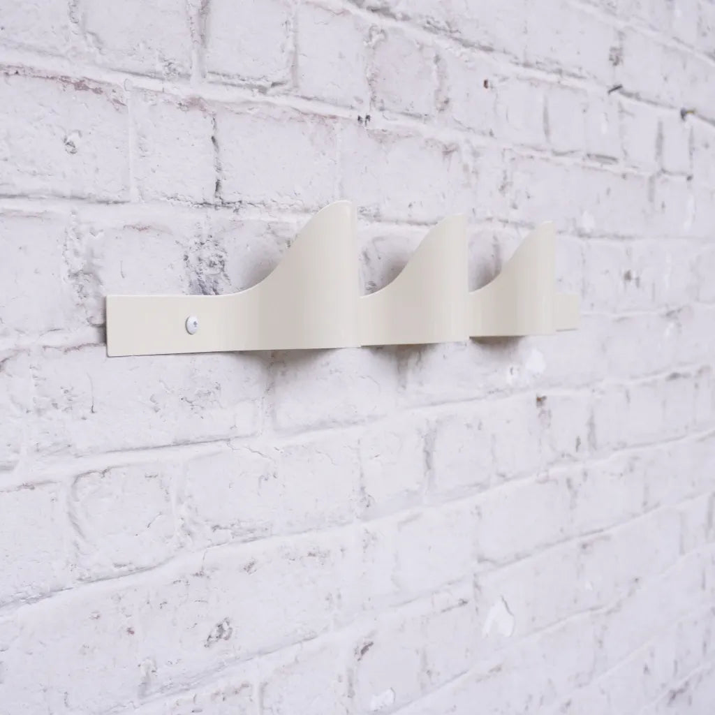 Halfwerk Waves coat rack with multiple hooks, modern wooden design for hanging coats and accessories.