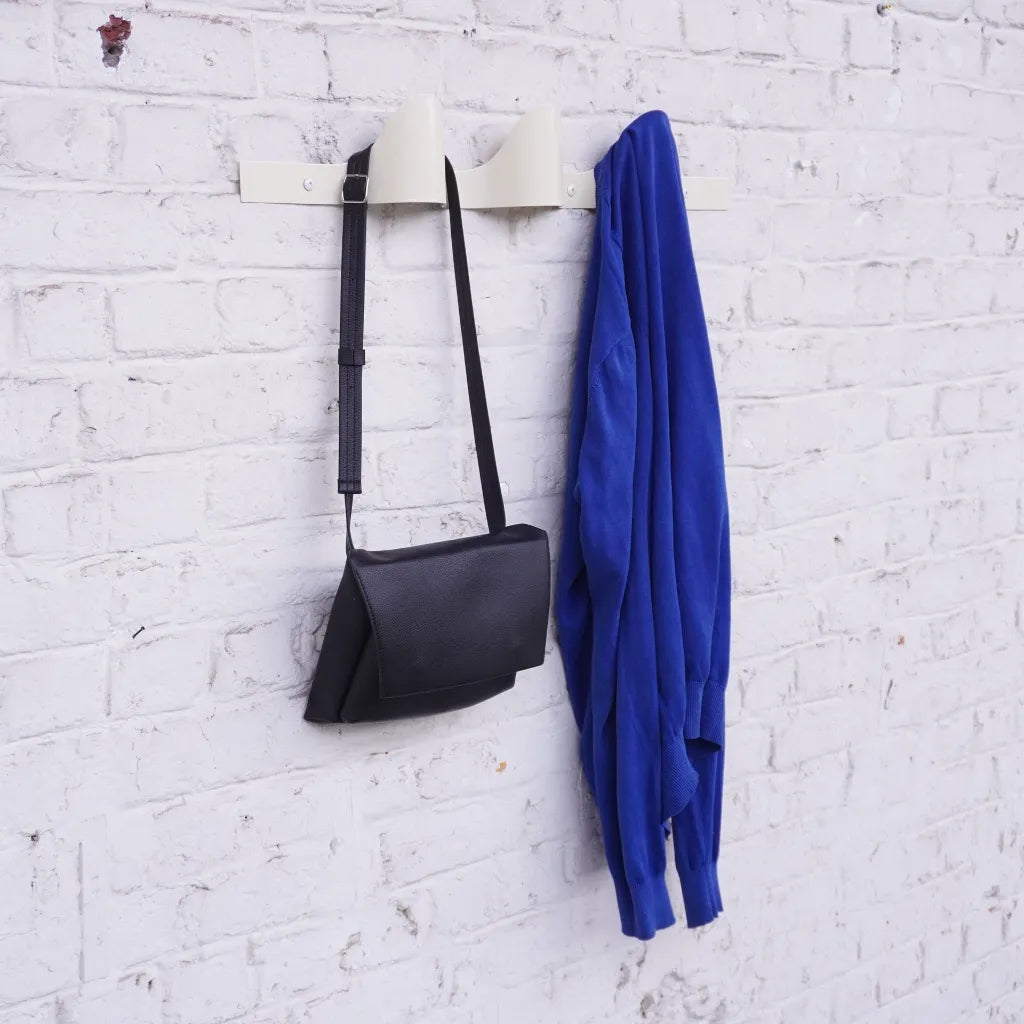 Halfwerk Waves coat rack with multiple hooks and wave design, perfect for organizing entryways and adding modern style.