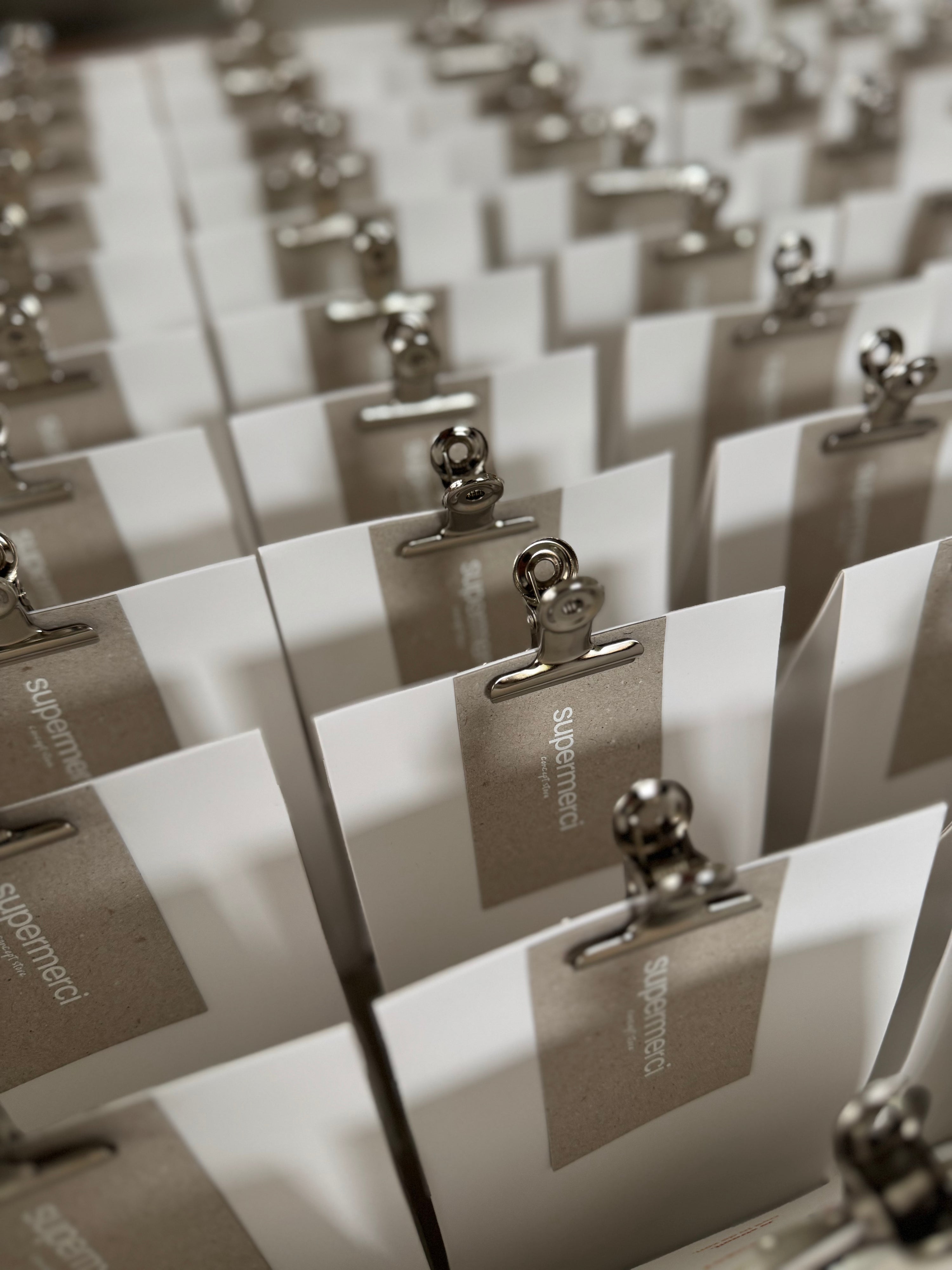 Gift wrapping service by supermerci, featuring elegantly wrapped presents with decorative paper and ribbons.