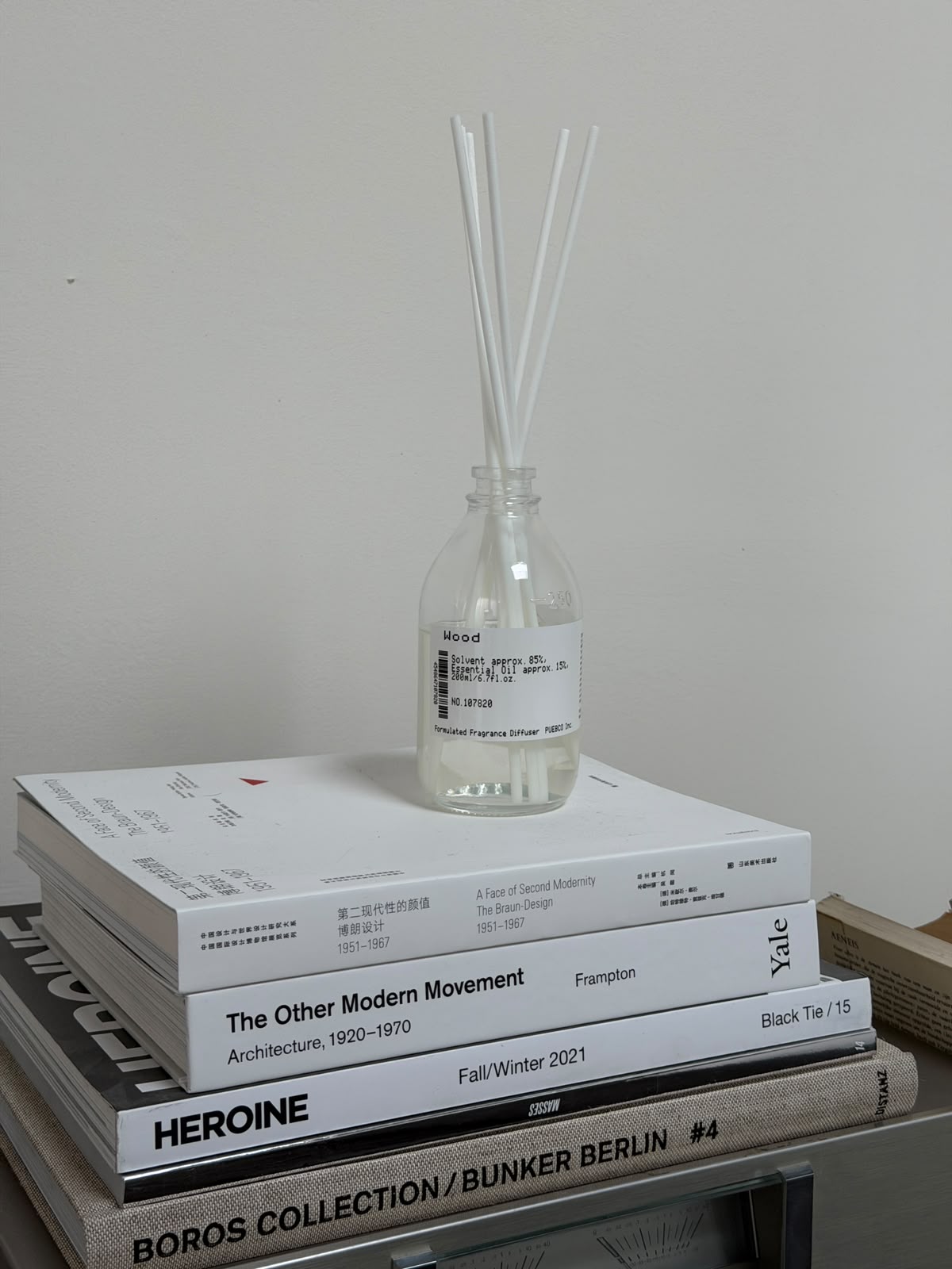 Puebco formulated fragrance diffuser with a sleek glass bottle and natural reeds, emitting a calming scent for home decor.