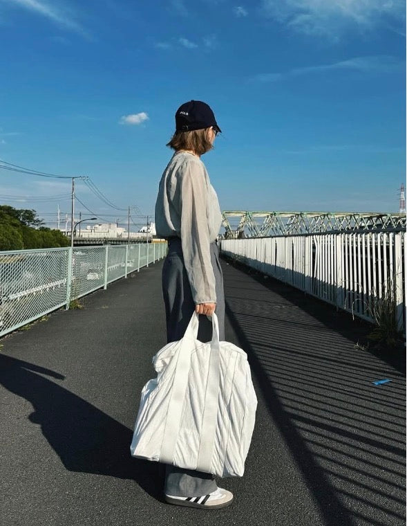 Vintage Puebco parachute tote bag with sturdy fabric and simple design, featuring handles and spacious interior.