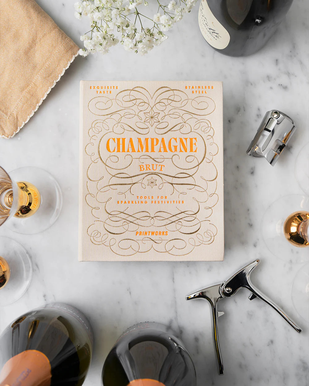 Printworks Champagne Celebrations gift set featuring festive champagne-themed decorations and accessories for special occasions.