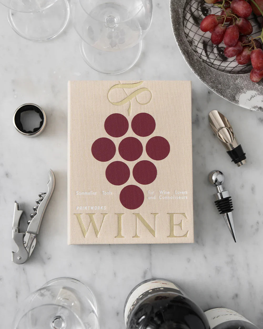 Printworks wine gift set with essential wine tools, including corkscrew, stopper, and foil cutter, arranged on a stylish wooden tray.