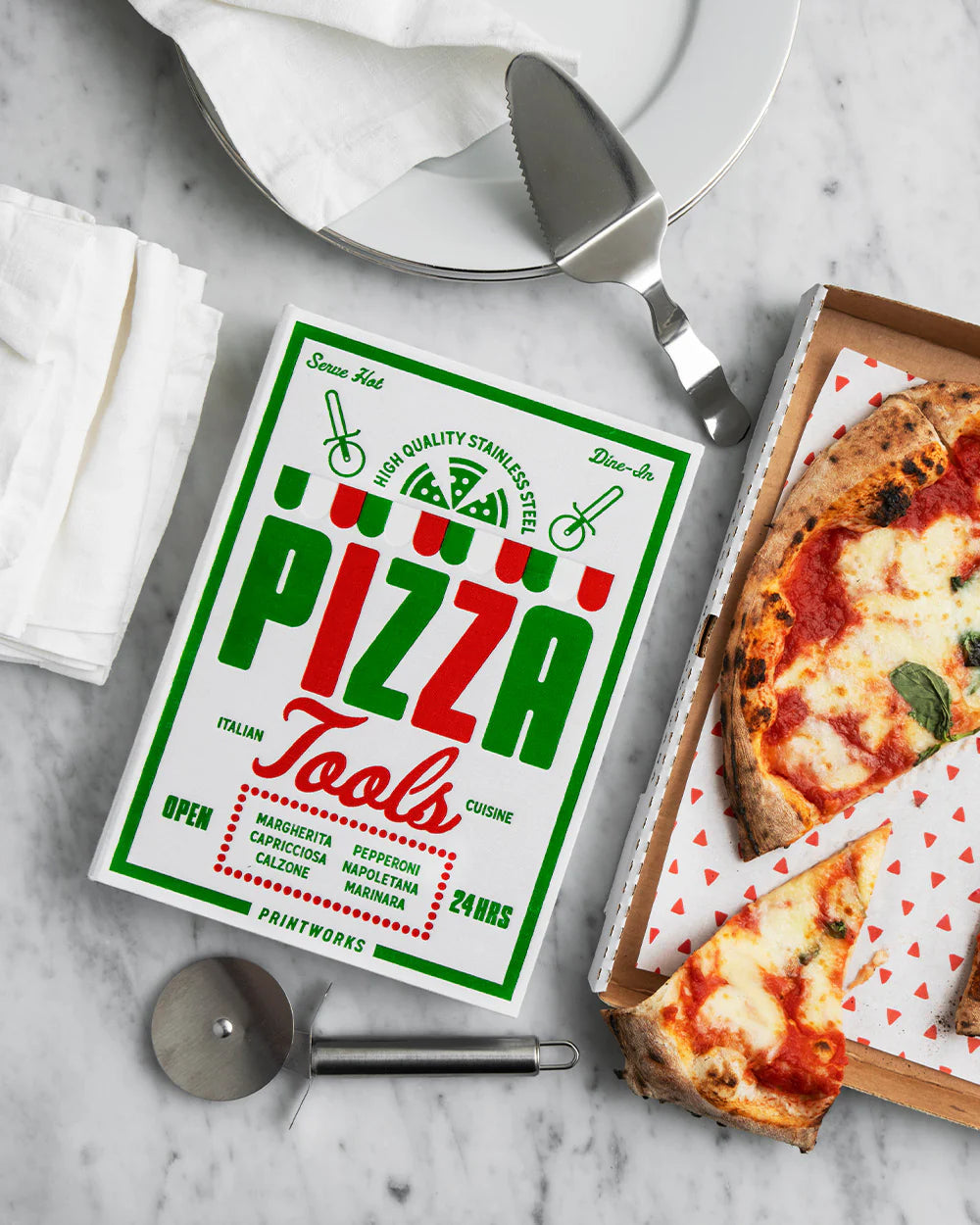 Printworks pizza tools gift set with pizza cutter, server, and utensils on a wooden board, ideal for pizza lovers and home chefs.