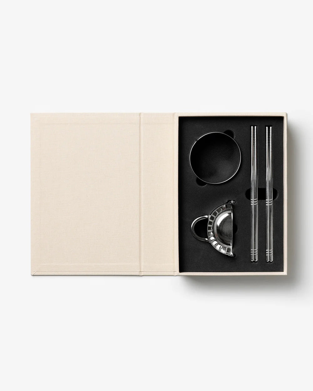 Printworks gift set of dumpling tools with multiple utensils for making and shaping dumplings, arranged on a neutral background.