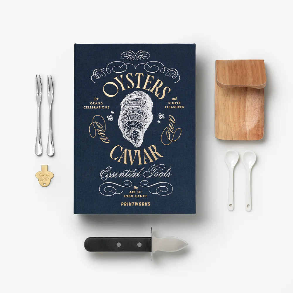 Printworks oyster and caviar tools gift set with oyster shucker, caviar spoon, and accessories on a white background.