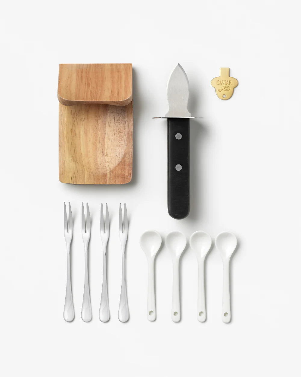 Printworks oyster and caviar tools gift set with stainless steel shucking knife, oyster forks, and caviar spoon on a white background.