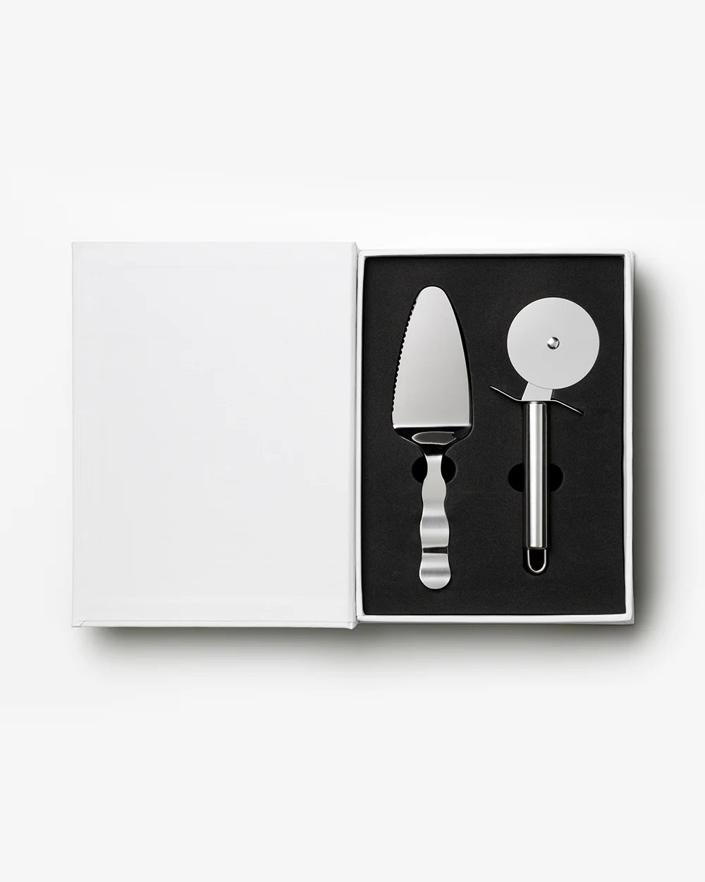 Printworks pizza tools gift set including pizza cutter, server, and peels, ideal for making and serving homemade pizza.