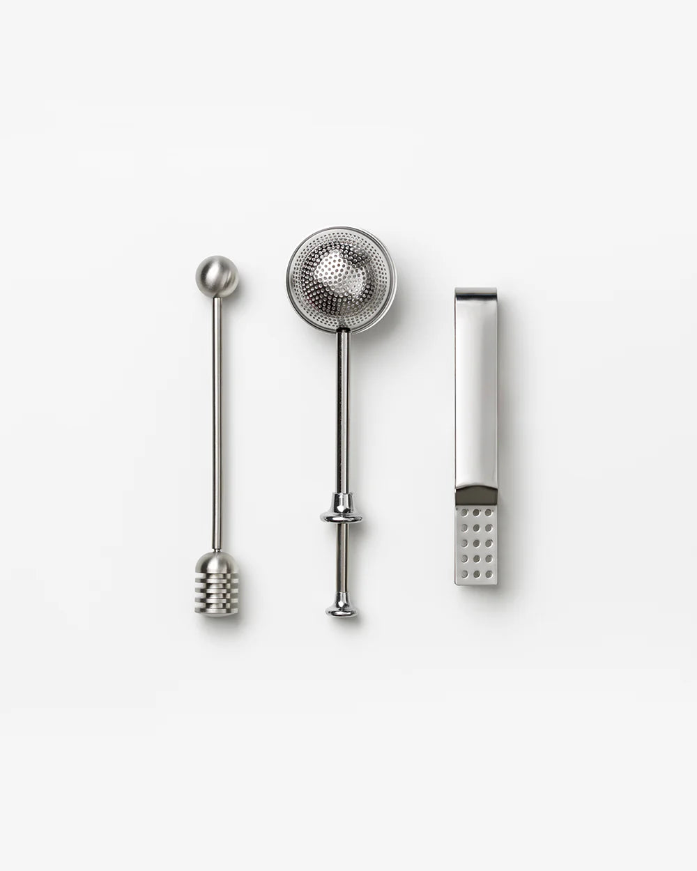 Printworks gift set of tea tools including a tea infuser, tongs, and spoon for brewing and serving tea.