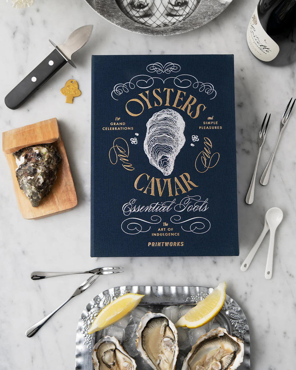 Printworks oyster and caviar tools gift set with stainless steel shucking knives, spoons, and accessories in a stylish box.