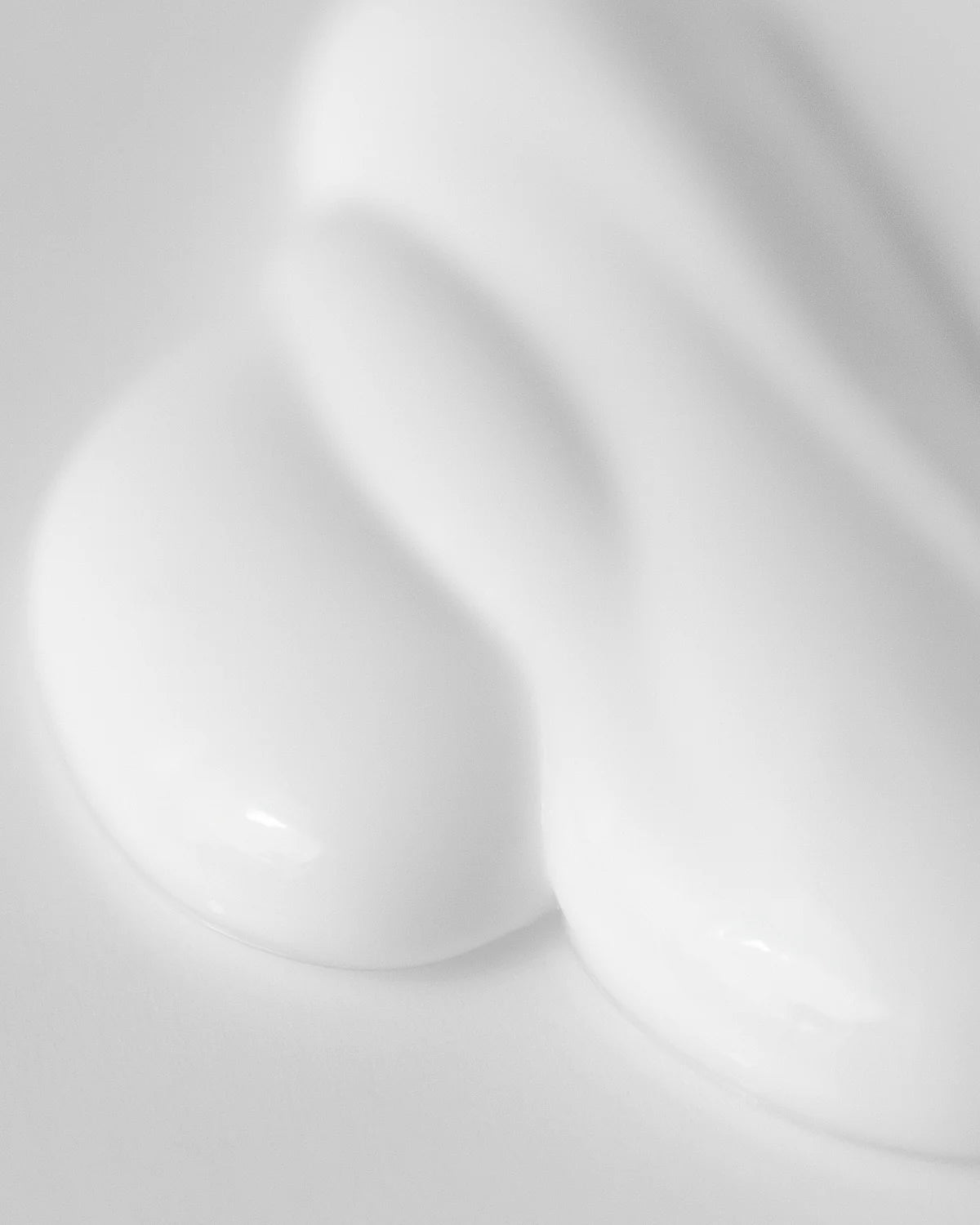 Ray hand cream with a smooth, creamy texture, showing application on hands in a close-up image.
