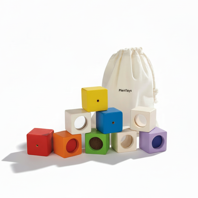 Colorful PlanToys sensory blocks set featuring various shapes and sizes for toddler play and developmental learning.